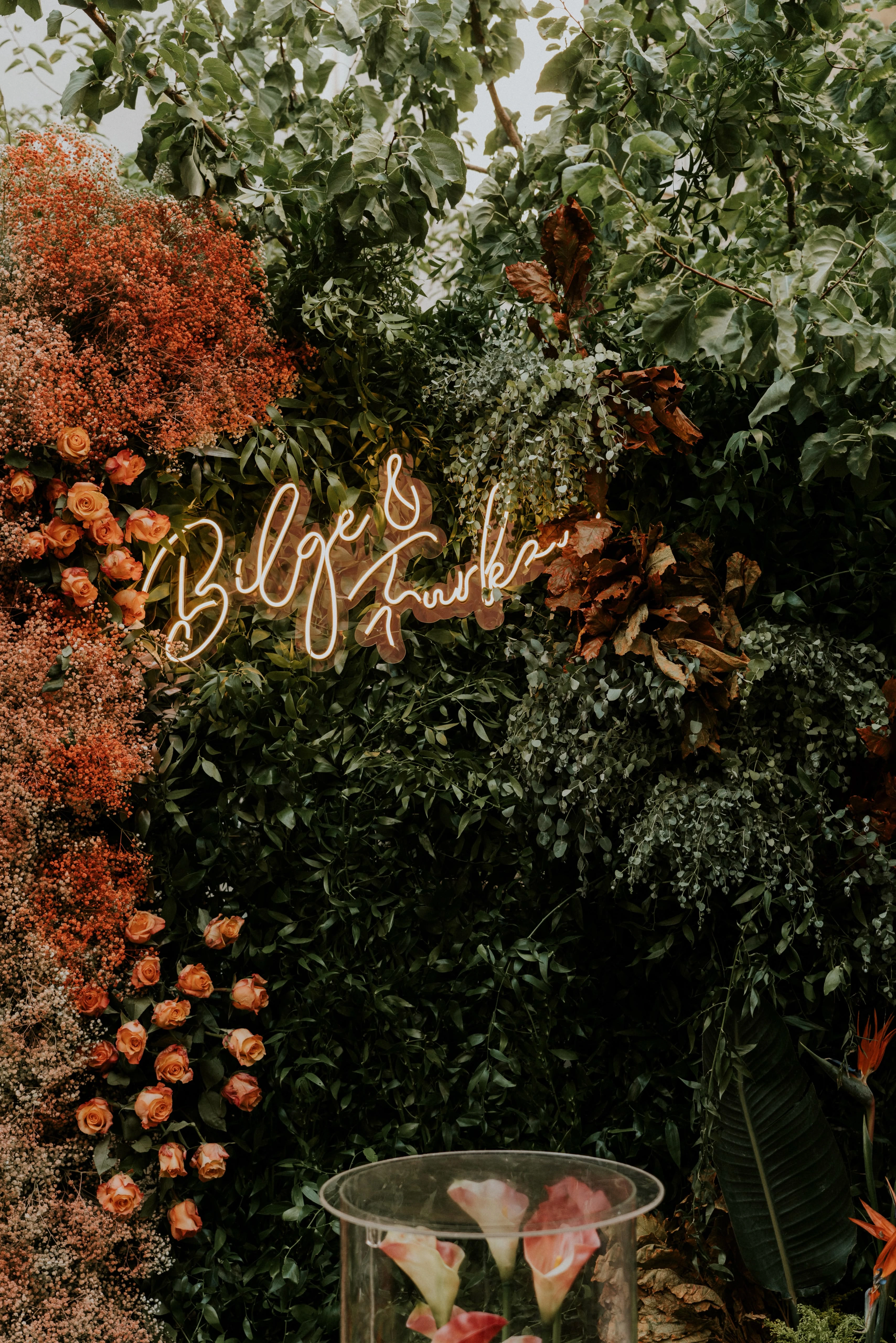 Garden engagement backdrop with orange flowers