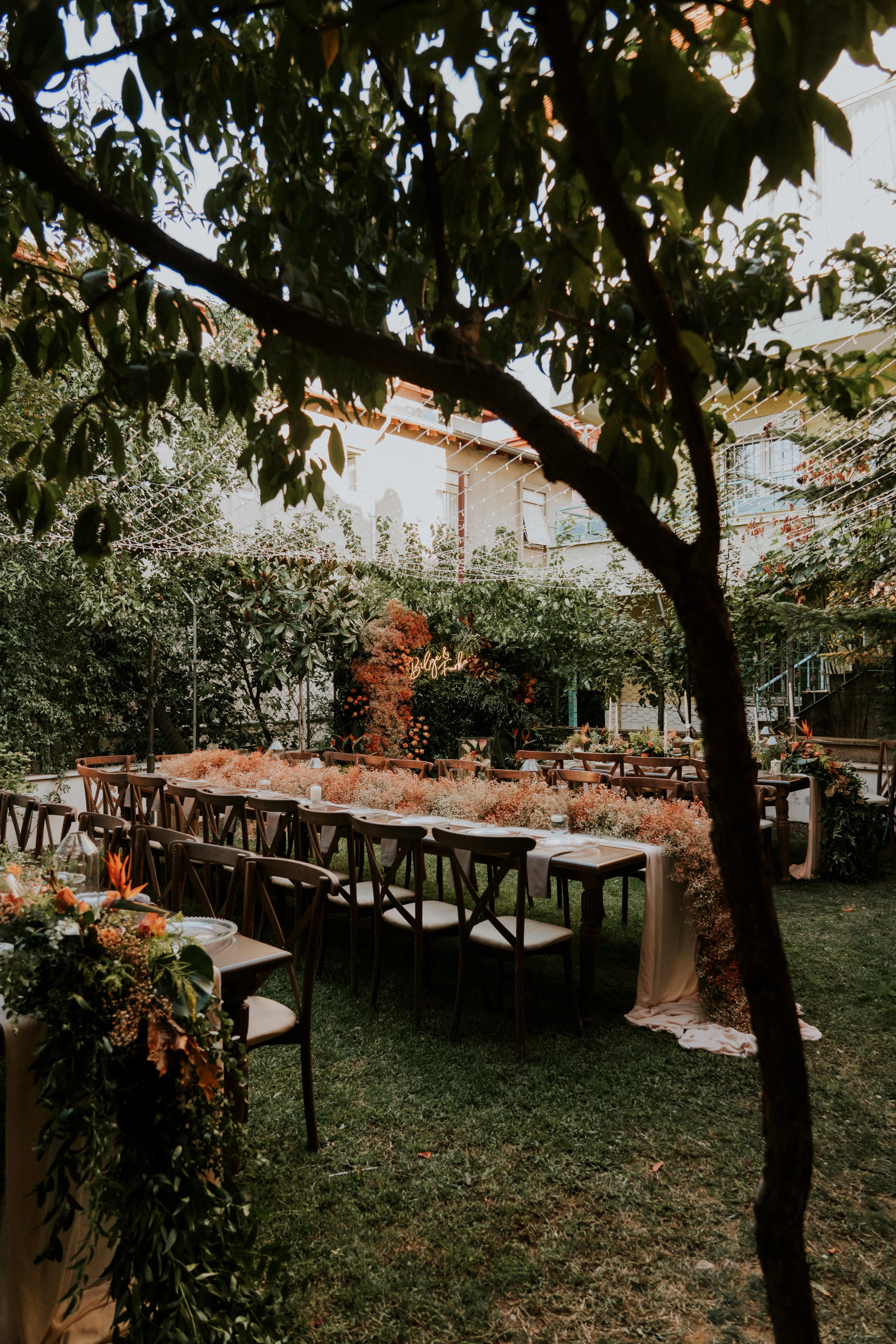 Long engagement table beneath the trees