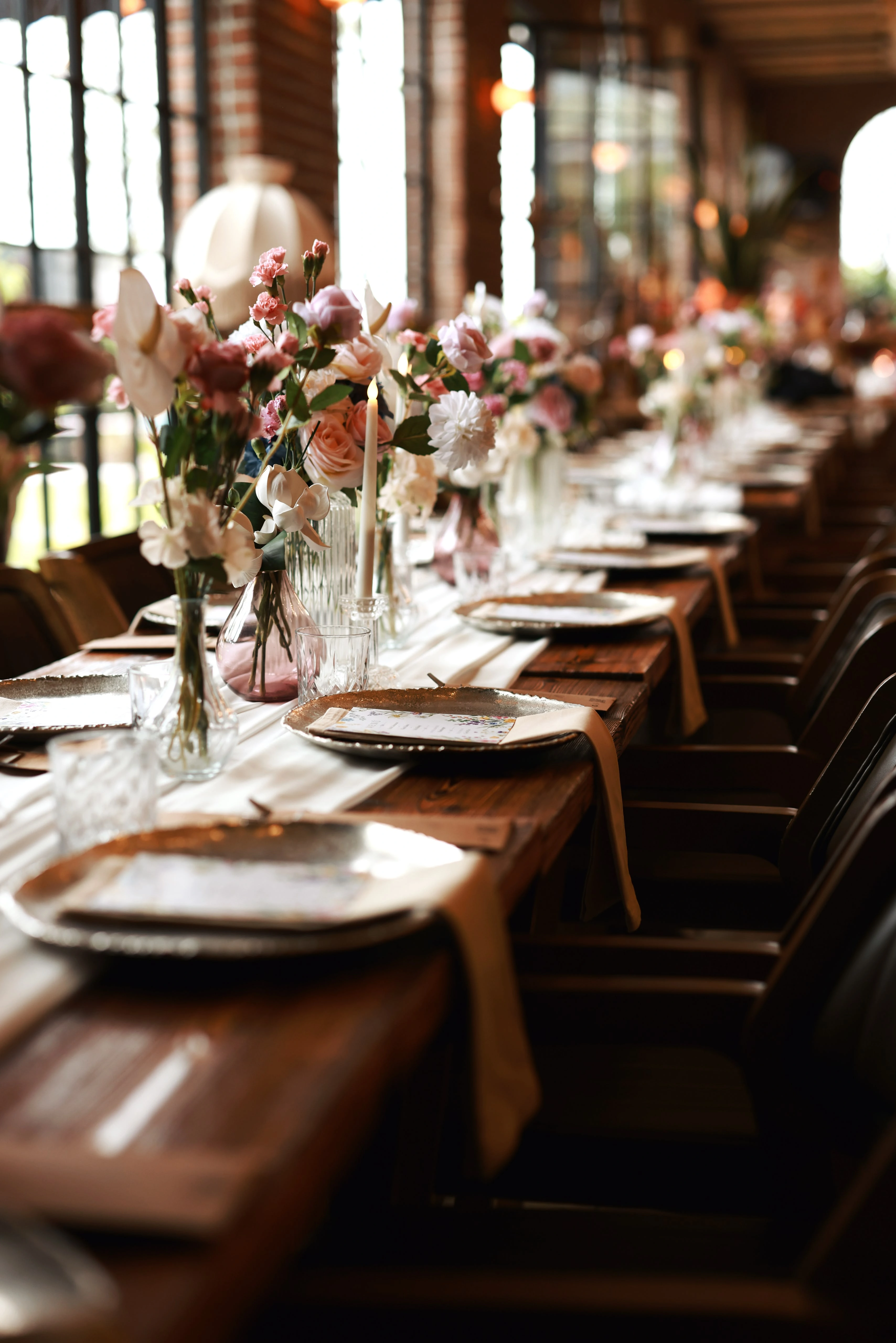 Timber engagement table running along the arched windows