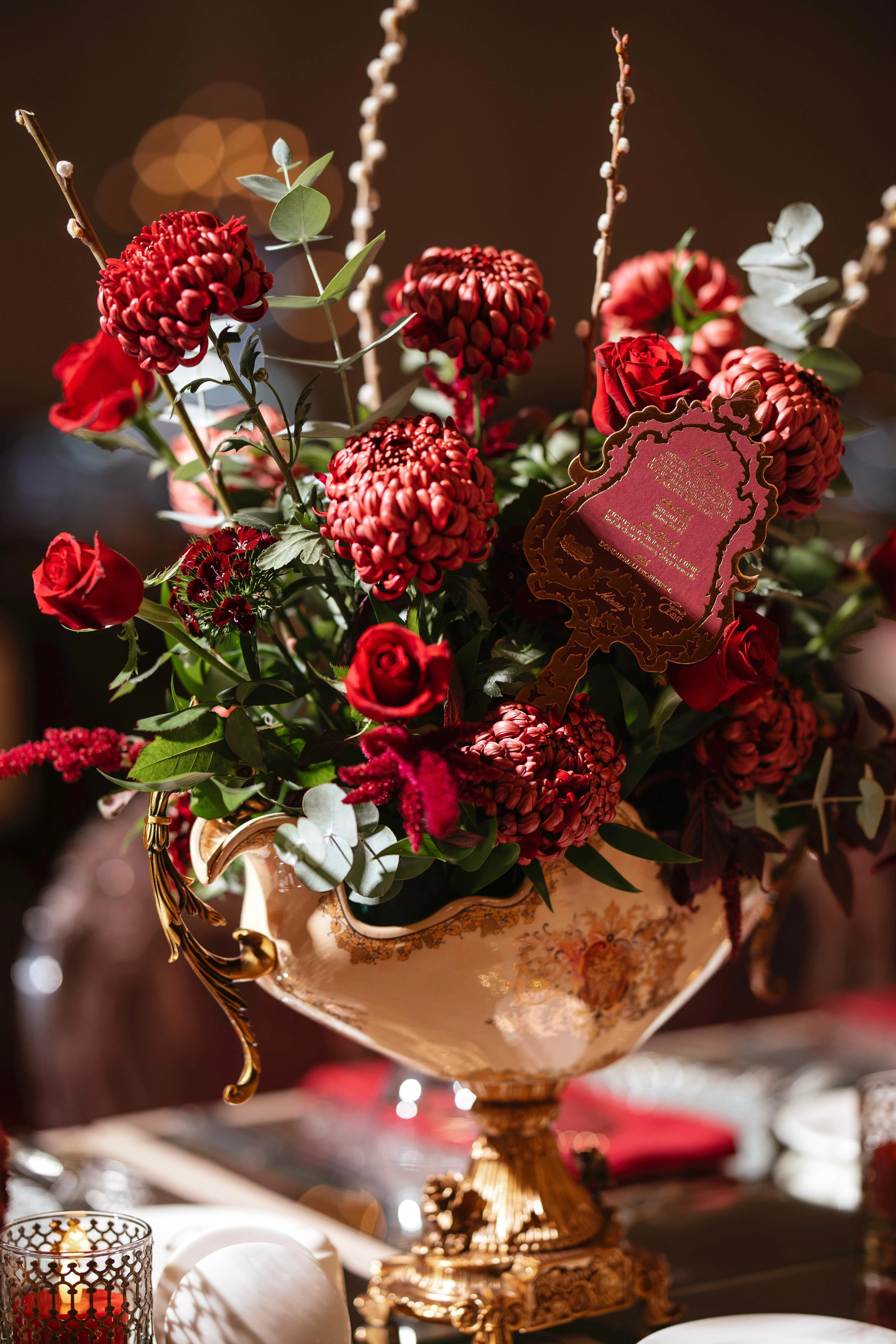 Burgundy roses, layered florals and an embroidered detail