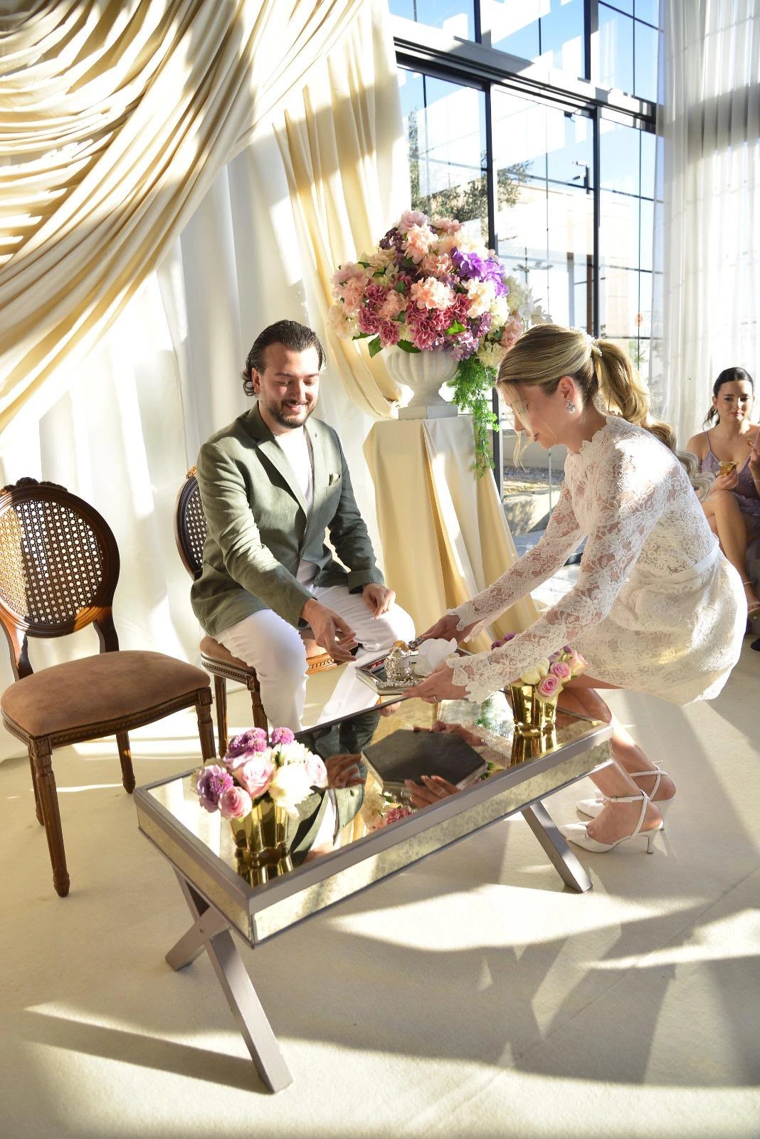 Engagement setting with ivory drapes and flowers, view 4