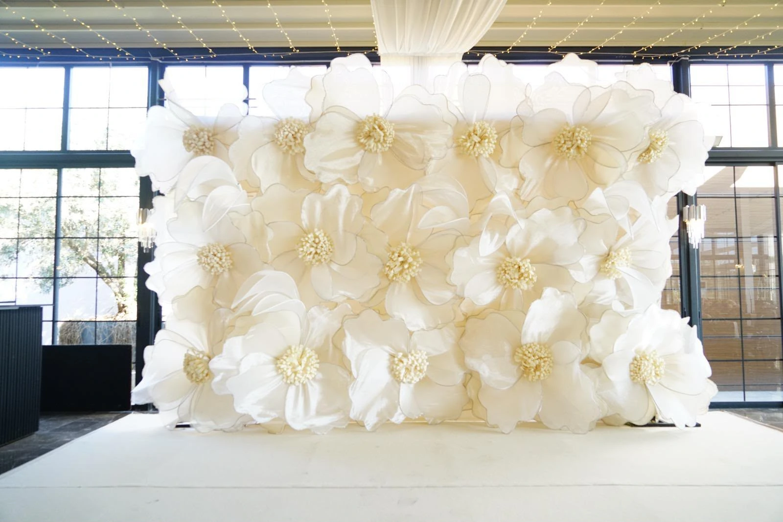 Engagement setting with ivory drapes and flowers, view 3