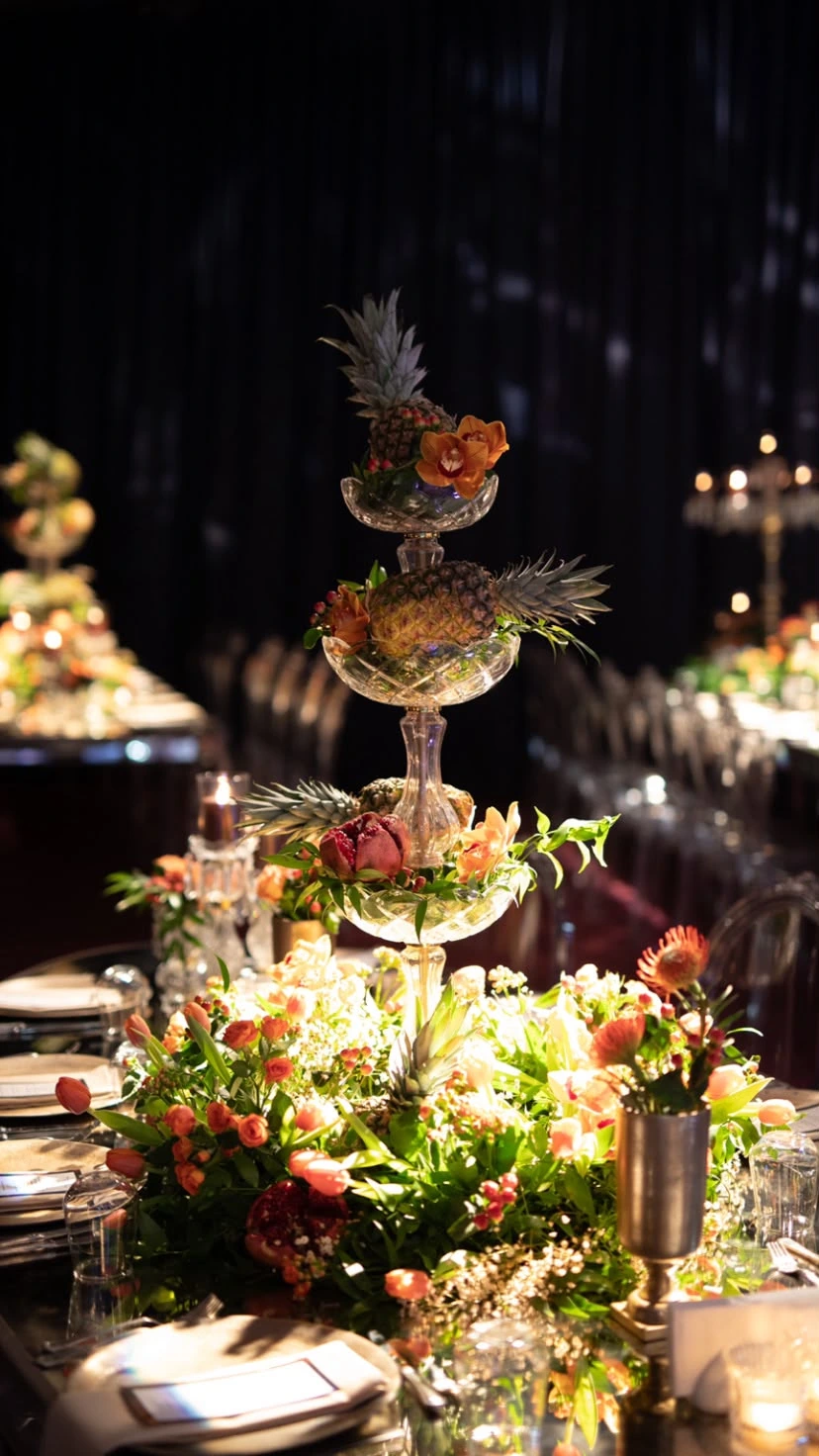 Tall table arrangement layered with crystal and flowers