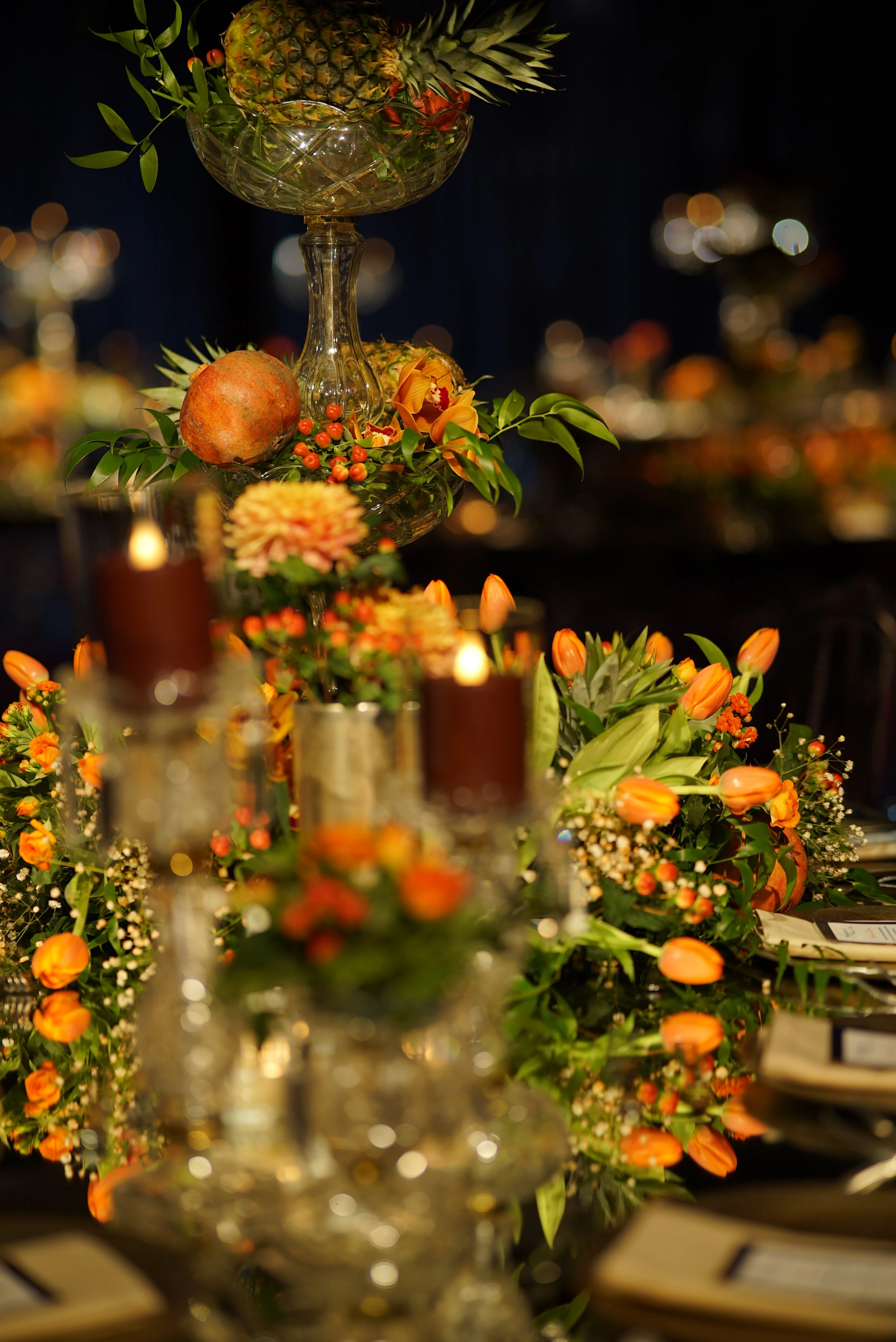 Fresh flowers and pomegranate details on a dark table