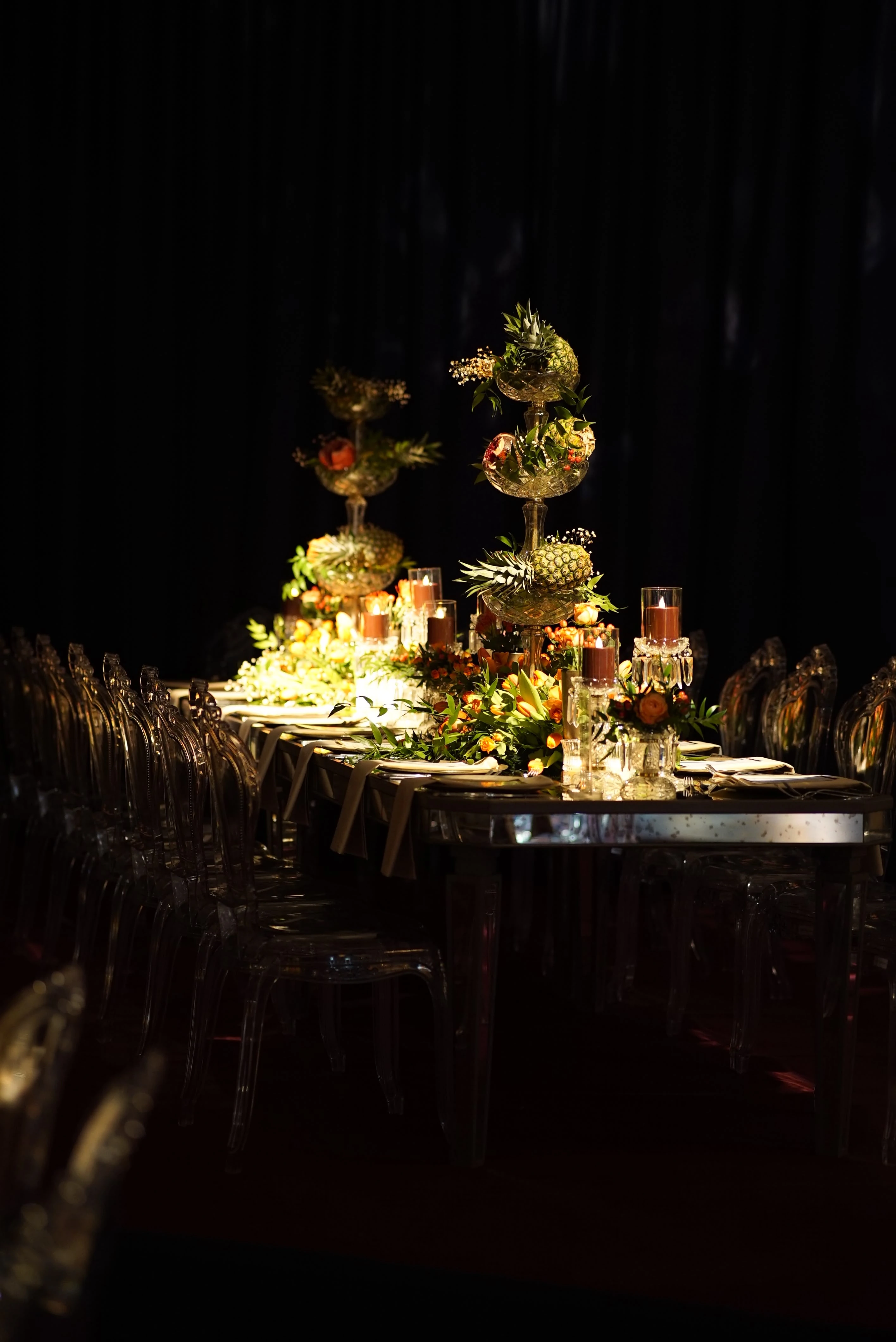 Table layout lit by layered orange flowers