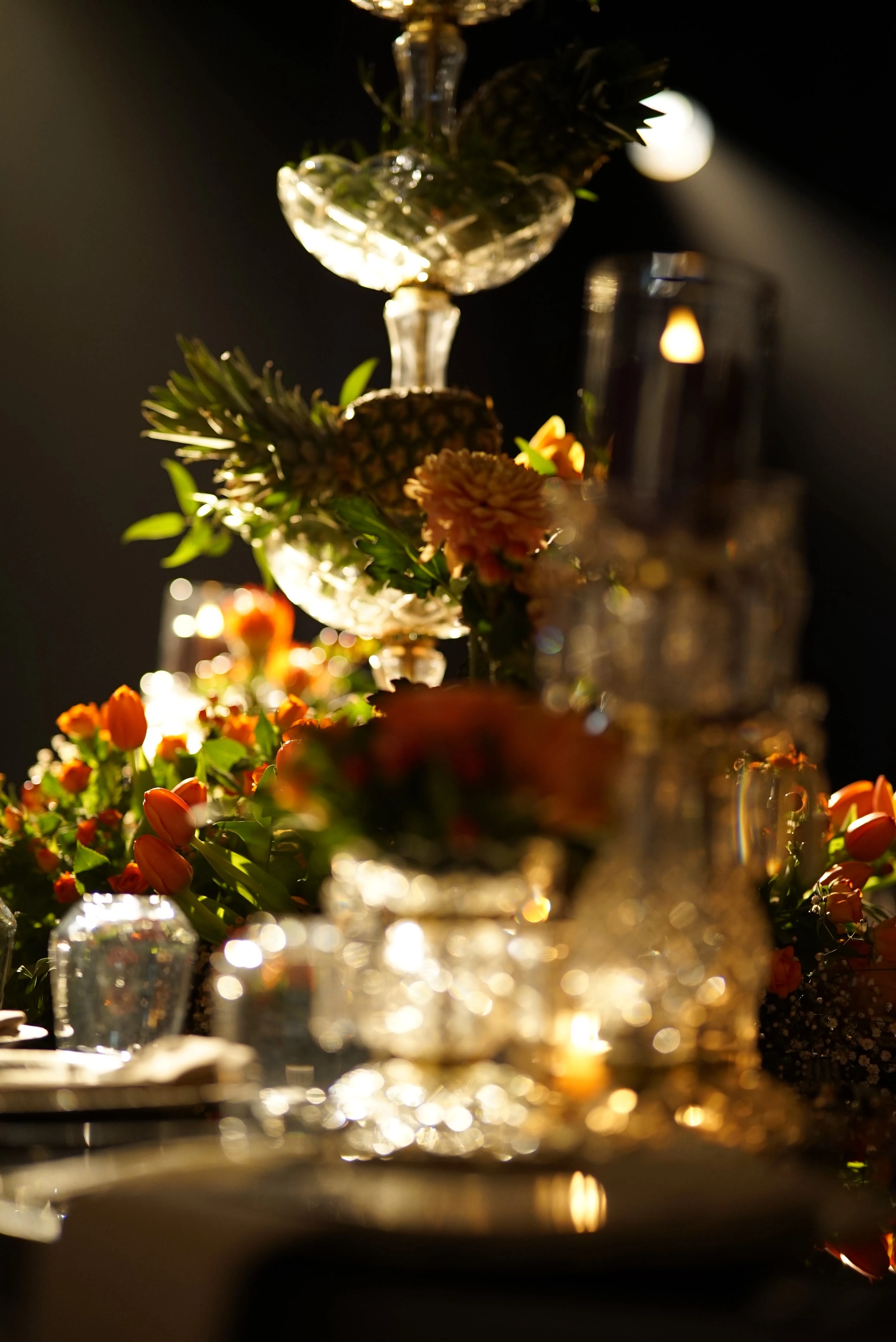 Dramatic table with a crystal fruit stand and flowers