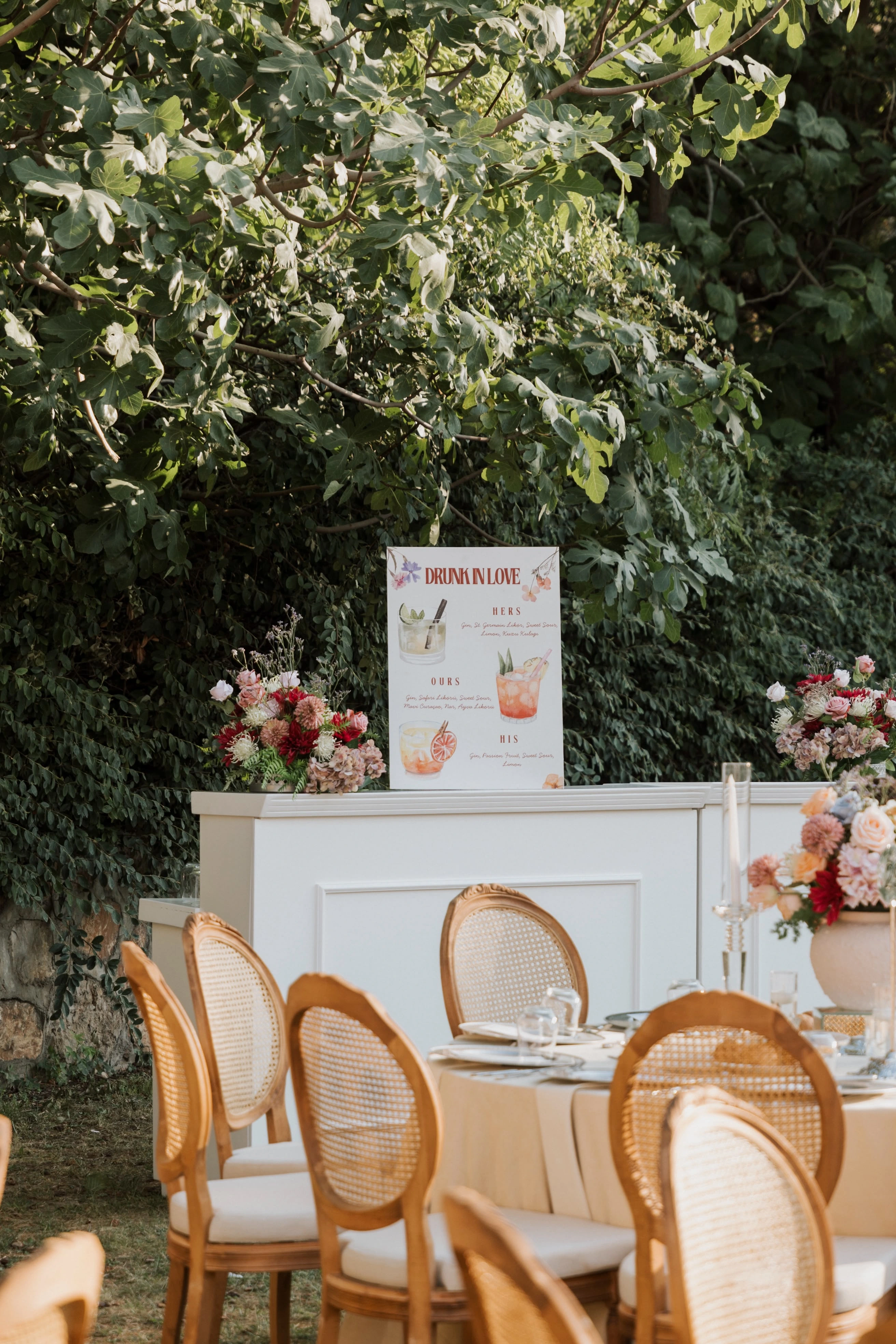 Garden engagement with crystal chandeliers, pastel flowers and wooden chairs, view 12