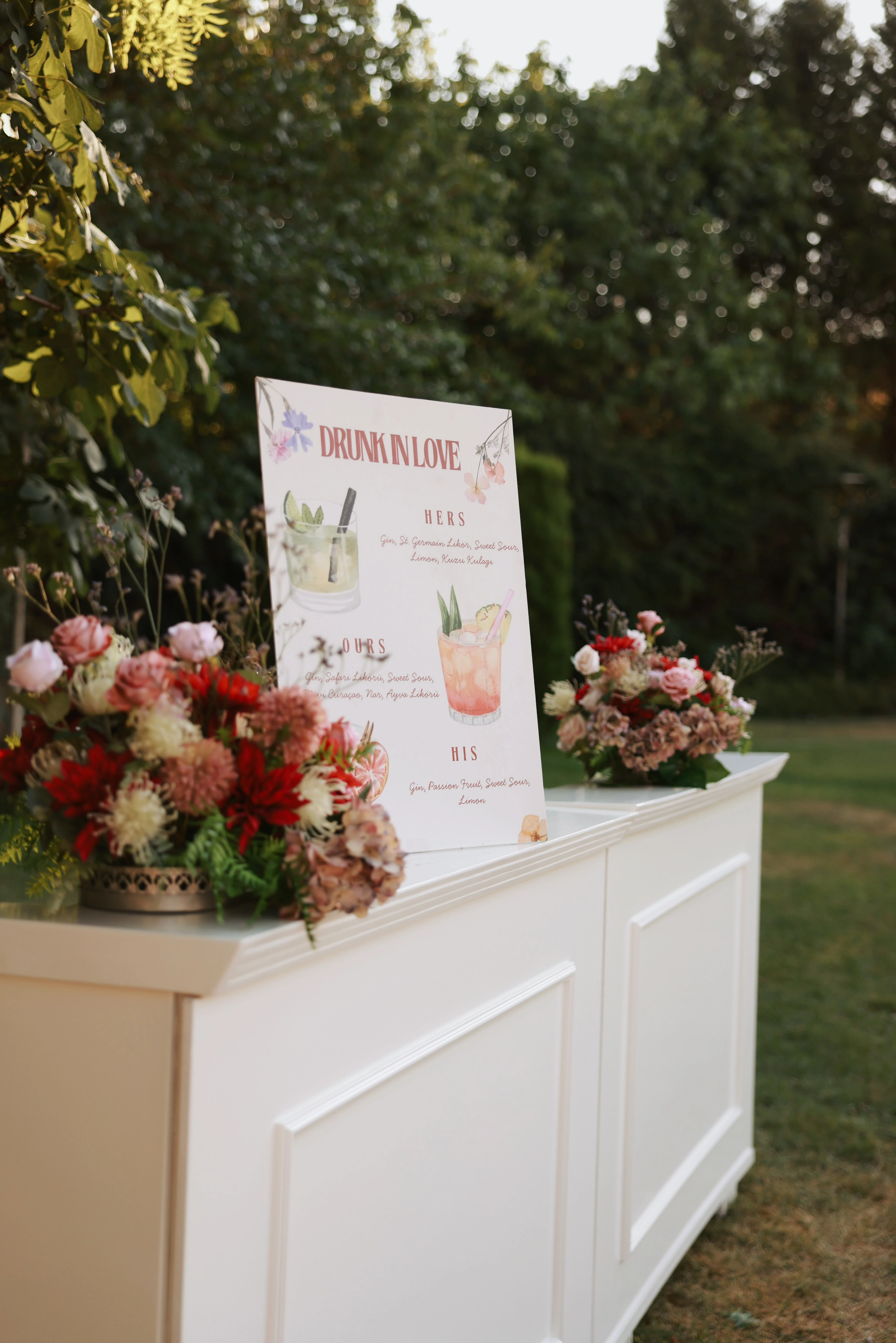 Garden engagement with crystal chandeliers, pastel flowers and wooden chairs, view 20
