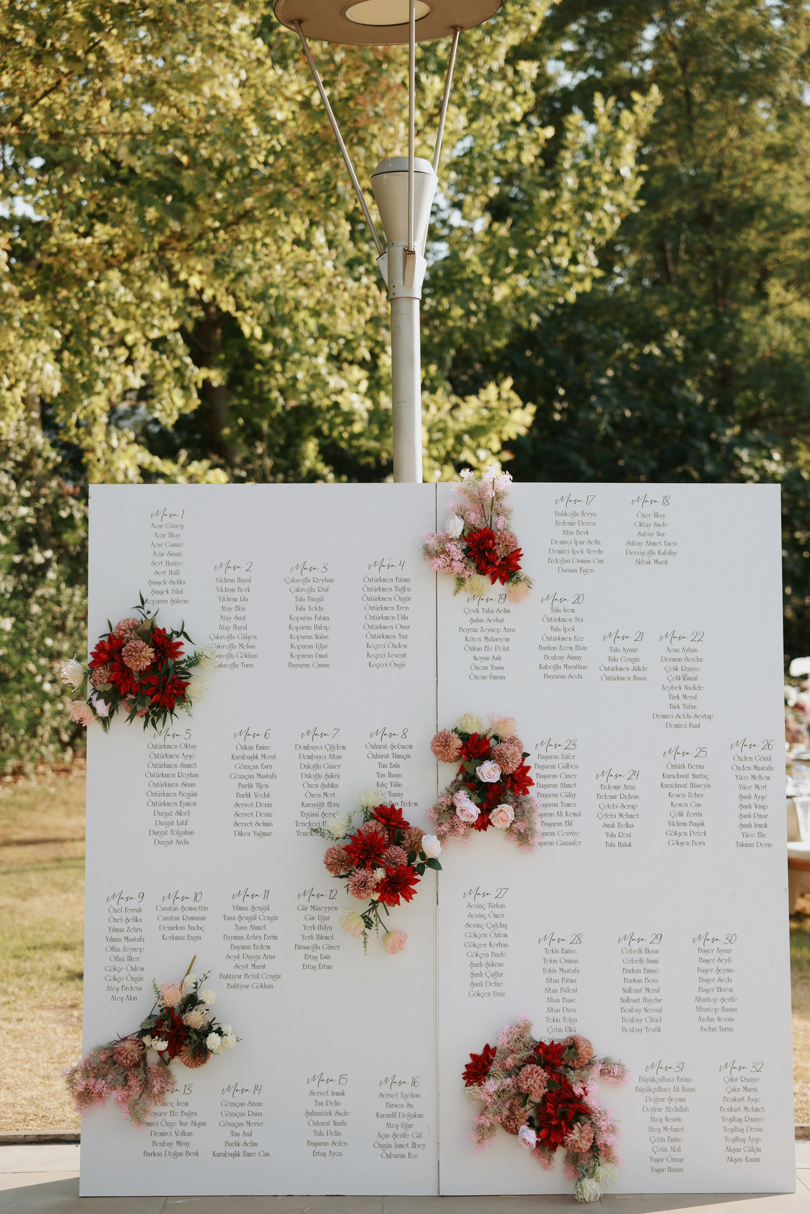 Garden engagement with crystal chandeliers, pastel flowers and wooden chairs, view 23