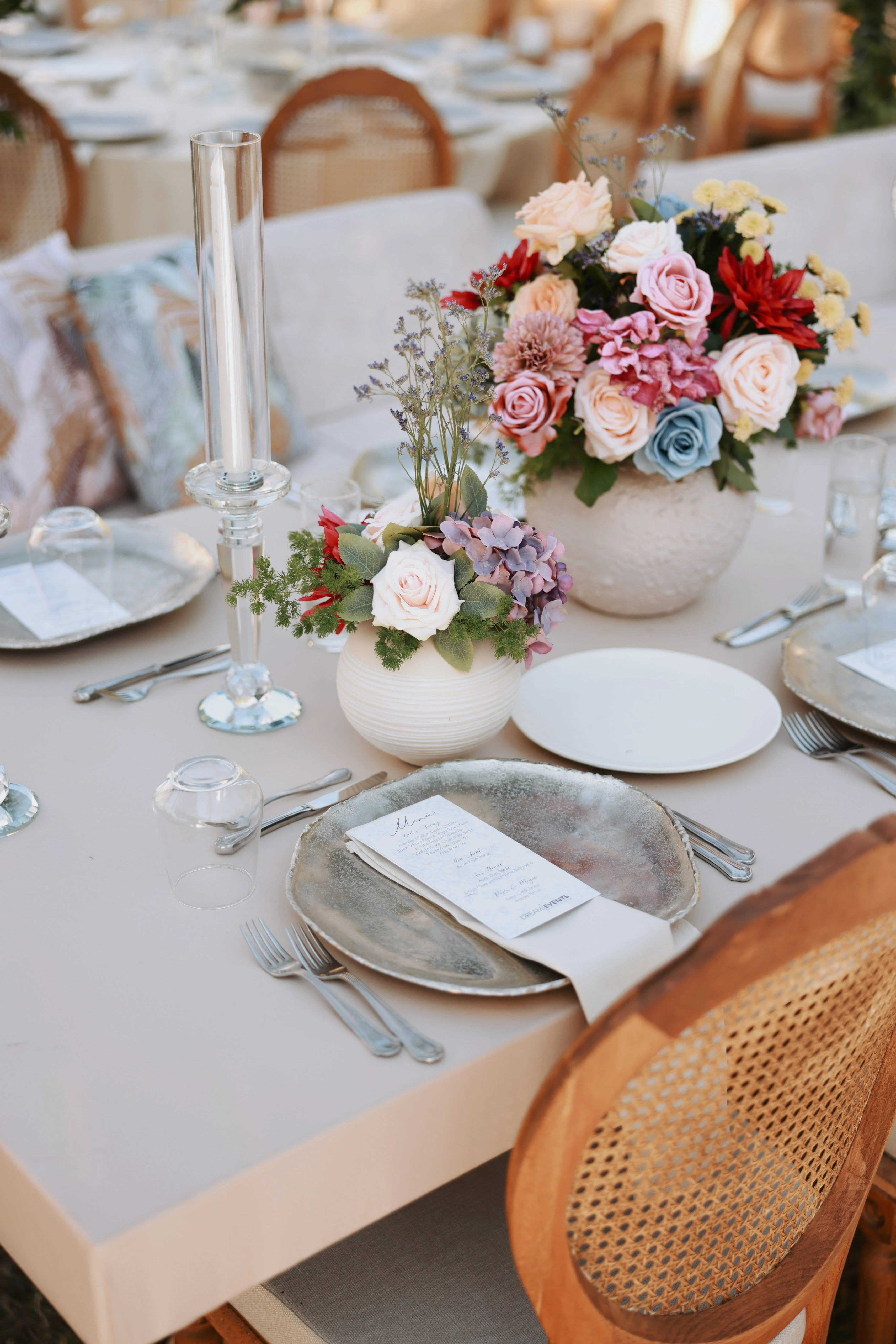 Garden engagement with crystal chandeliers, pastel flowers and wooden chairs, view 27