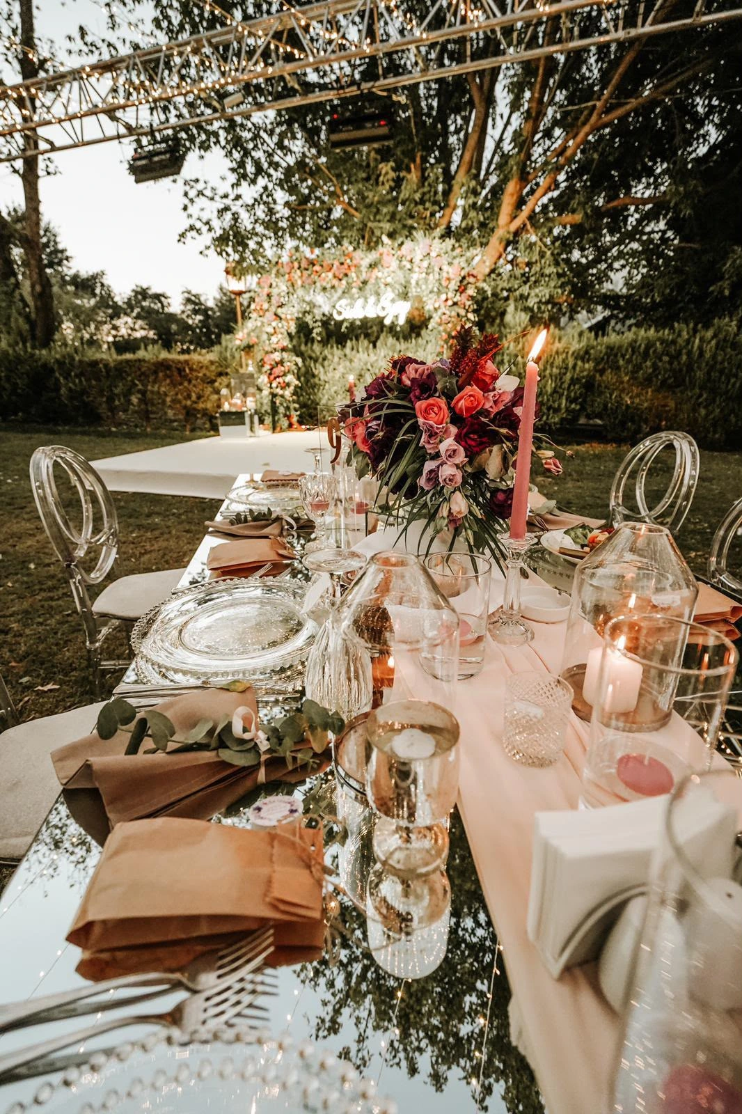 Mirrored table perspective with pink flowers and glass details